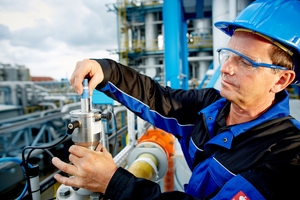 pH calibration in a chemical plant by a male service technician